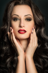 Gorgeous woman portrait with makeup red lips and smoky eyes