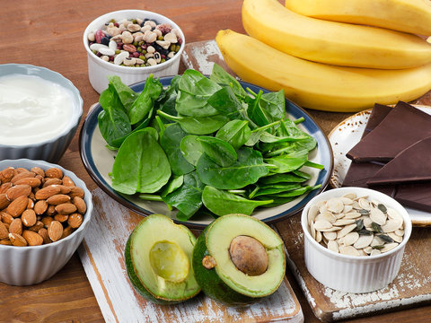 Foods High in Magnesium on a wooden table.