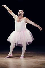 funny fat classical dancer on black background