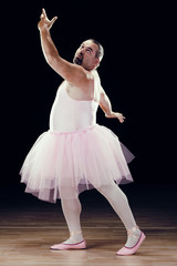 Obraz premium funny fat classical dancer on black background
