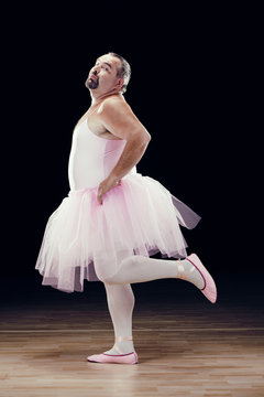 funny fat classical dancer on black background