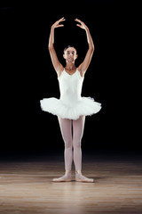 Fototapeta premium beautiful classical dancer on black background