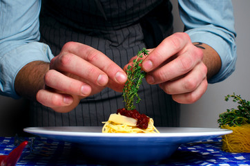 one man prepares pasta house
