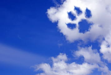 dog paw trail in the sky clouds - 107831392