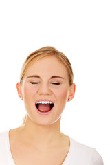 Stressed or angry young woman screaming