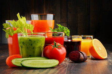 Glasses with fresh organic vegetable and fruit juices