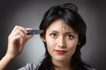 Obraz premium pluging memory stick into head