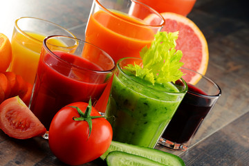 Glasses with fresh organic vegetable and fruit juices