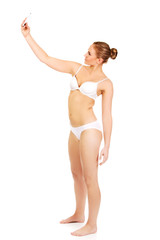 Young woman in underwear makes photo of herself