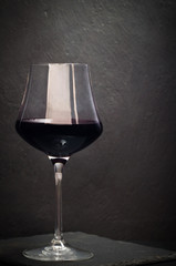 red wine glass in elegant dark contest