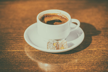morning creativity concept of cup coffee with delight, instagram style or toned effect, close up