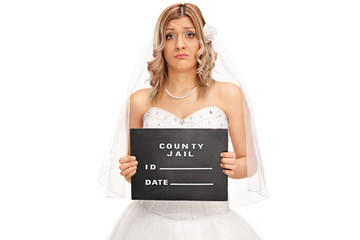 Sad young bride posing for a mug shot