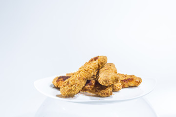 Plate of Chicken Fingers, Fried Frozen Food at Home