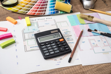 scheme house with a palette of colors and a calculator