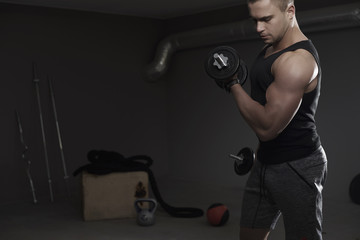 Muscular man working out at the gym.