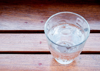 Glass Water on wooden floor.