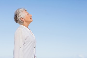 Senior woman relaxing on the beach