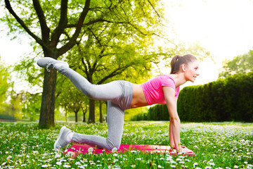 Fit young woman exercising outdoors, healthy lifestyle