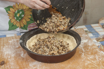 Putting filling on raw dough
