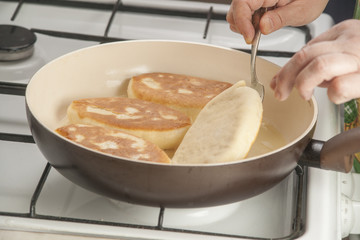 Patties with potato in the pan