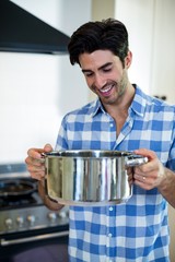 Young man preparing food in kitchen