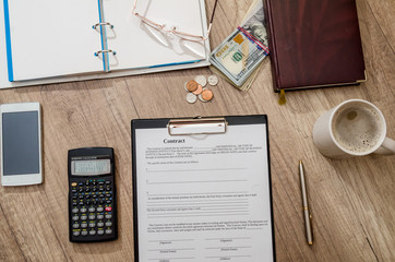 empty contract with office accessories on desk