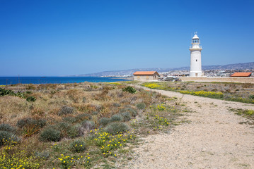 Fototapeta na wymiar Beautiful historic Retro Lighthouse at Paphos, Cyprus