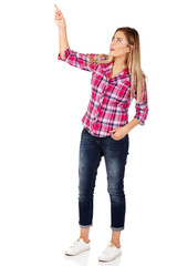 Young woman pointing at something 