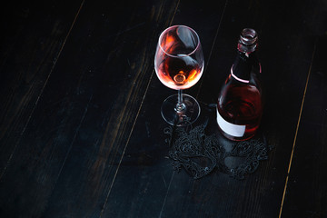 Bottle of red wine on the wooden table