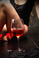 glass of red wine on wooden table