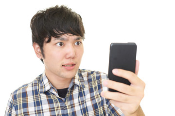 驚いた表情の大学生