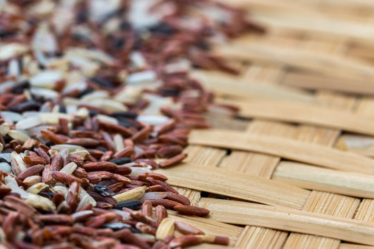 Mix rices : white (jasmine) rice,riceberry and brown rice on  threshing basket