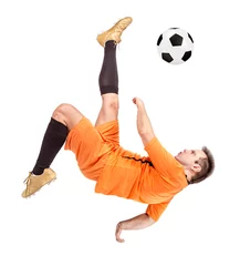 Poster Soccer football player kicking the ball isolated on a white background © milkovasa