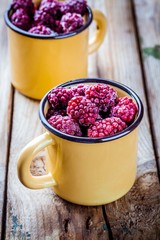 Frozen blackberries in a mugs