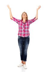 Obraz premium Happy blonde woman standing with hands up 