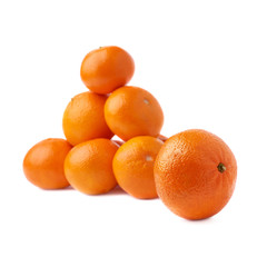 Pile of multiple ripe fresh juicy tangerines, isolated over the white background