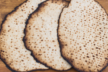 Matzot for passover celebration on a wooden table