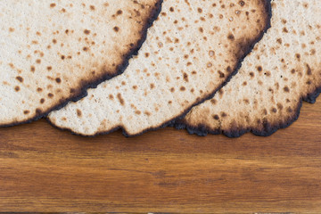 Matzot for passover celebration on a wooden table