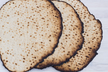 Matzot for passover celebration on a wooden table