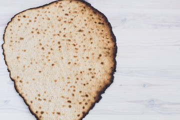 Matzot for passover celebration on a wooden table