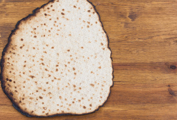 Matzot for passover celebration on a wooden table