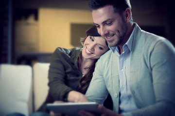 young casual couple flirt in the living room