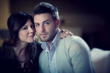 young casual couple flirt in the living room