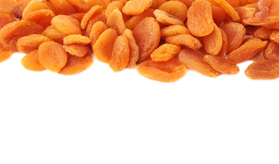 Dried orange apricots over white background