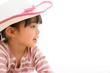 Obraz na płótnie Canvas asian smiling little girl with hat isolated on white