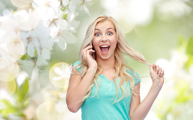 smiling young woman calling on smartphone