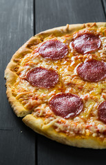 Pizza with cheese and salami