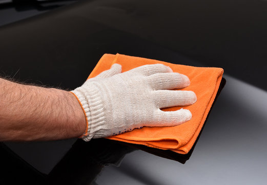 Cleaning car with microfiber cloth