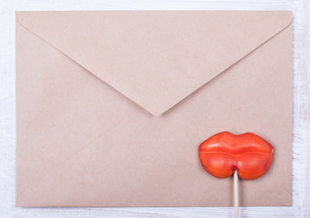  love letter background. envelope and candy in form female lips