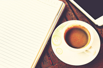 workplace, Coffee cup on wooden table - Vintage effect style pictures, over light [blur and select focus background]